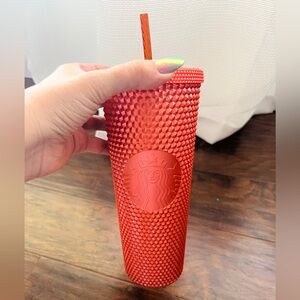 Orange studded large Starbucks cup